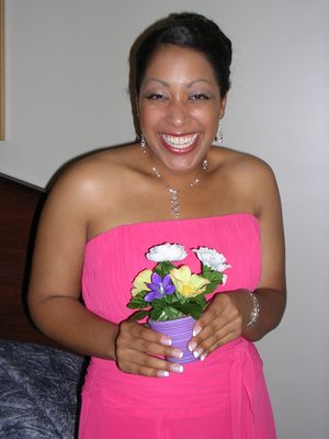 Tanya loves her little pot of fake flowers.